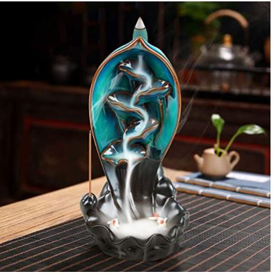 This waterfall incense burner is a beautiful work of art. It comes with 120 backflow incense cones, 30 incense sticks, and a mat. It's perfect for home, office, yoga, or aromatherapy.