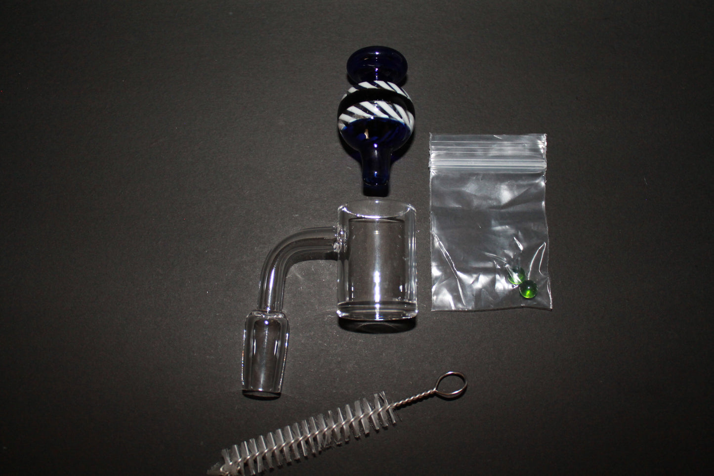 KB Quartz Banger and accessories 1 piece Quartz Banger, 1 Piece Blue and White Carb Cap, 2 Piece Green Glass Beads, 1 Piece Cleaning Brush